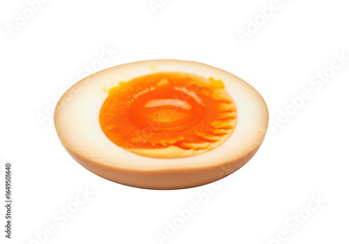 Perfectly halved ramen egg revealing its rich, custardy yolk, a gourmet culinary delight isolated on pristine white.