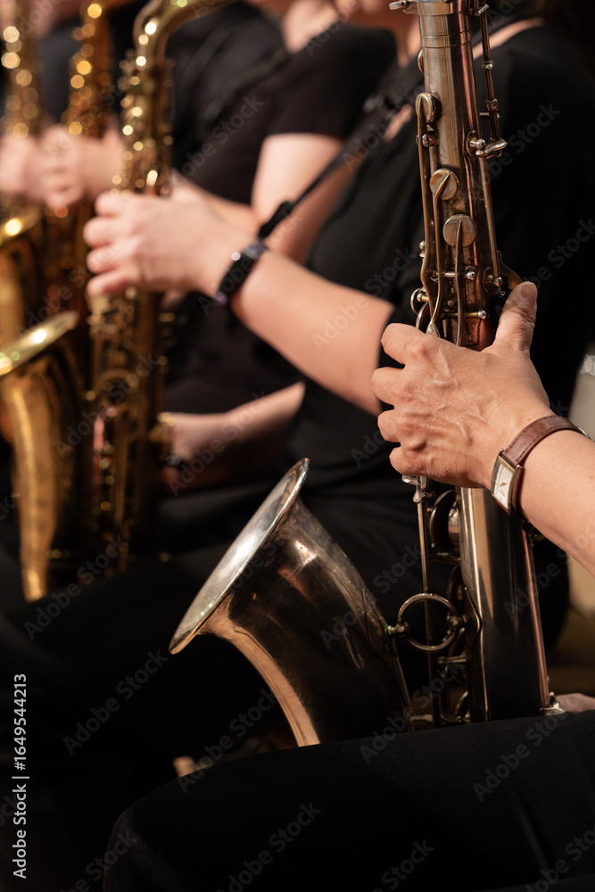 Fototapeta premium young man playing saxophone