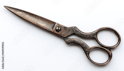 Antique copper-toned scissors, sharp points, ornate handles, isolated on white
