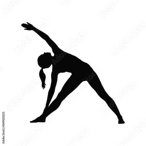 Silhouette of a woman performing a yoga triangle pose