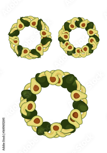 Artistic arrangement of sliced avocados forming circular wreath shapes on a white background demonstrating healthy food composition