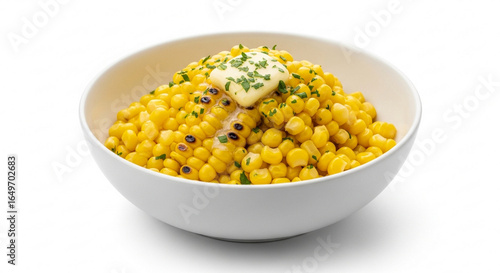 Close-up shot of a bowl filled with cooked corn kernels topped with butter and parsley.