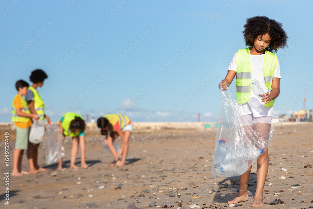 Busy diverse teenager people in uniform and black curly girl collect garbage and plastic bottles in bag on beach. Environment care, clean up, save planet, recycle, protect sea Busy diverse teenager people in uniform and black curly girl collect garbage and plastic bottles in bag on beach. Environment care, clean up, save planet, recycle, protect sea