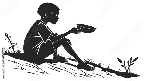 A young boy sits on the ground holding out an empty bowl in a black and white silhouette image