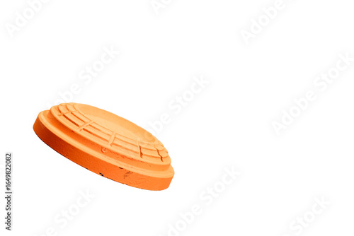 clay orange target flying in air with transparent background, used for sporting clays, skeet and trap