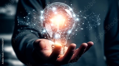 Illuminating Ideas: A Hand Holding a Networked Light Bulb
