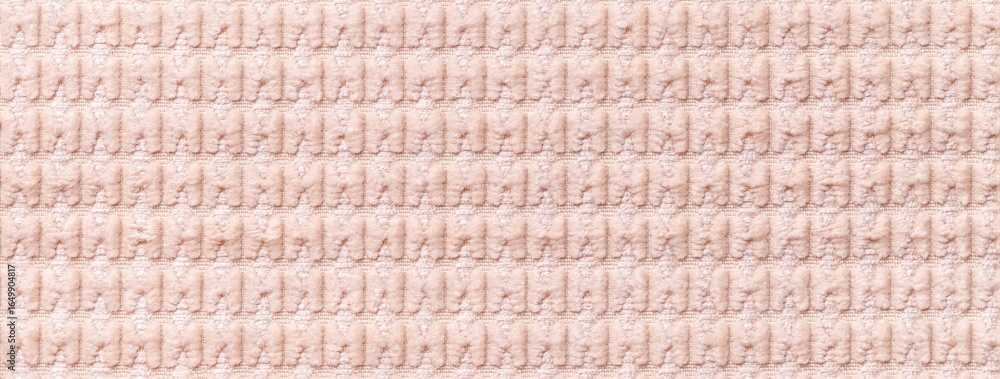 Obraz premium Texture of light pink velour textile with quilted pattern, macro. Structure of plush rose fabric material backdrop