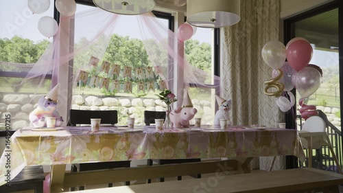 Wide shot of kitchen dressed for girl's birthday party