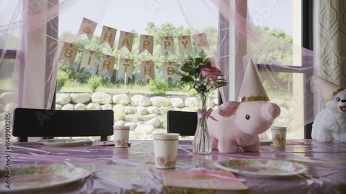 Decorations for little girl's birthday with pink pig plushy - medium shot