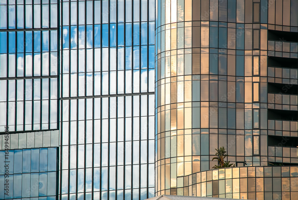 custom made wallpaper toronto digitalAbstract reflection of sky and clouds on modern glass building facade with colorful windows