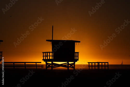 Sunset light over the beach of Santa Monica and the lifeguard
