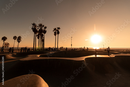 The most famous skate park on the world in Venice Beach during the sunset in Los Angeles.