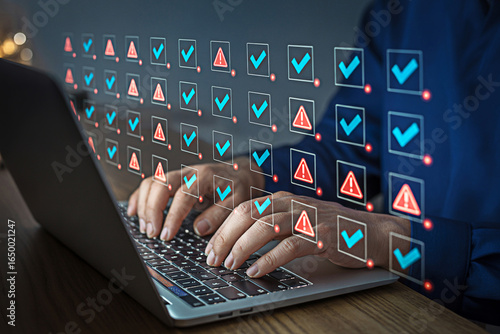 Man using laptop for online checklist with tick marks and error warnings for quality control