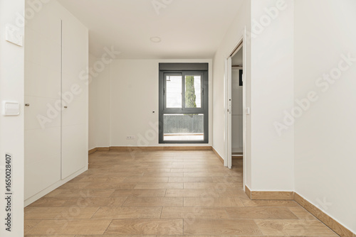 Wallpaper Mural Minimalist unfurnished bedroom with white beechwood wardrobes, a floor-to-ceiling door design with no visible baseboard Torontodigital.ca