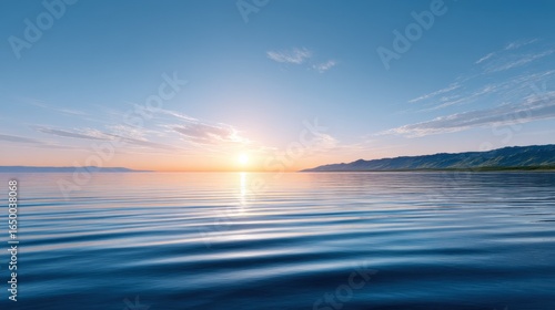 Serene sunset over calm waters, with gentle ripples reflecting the warm hues of twilight.