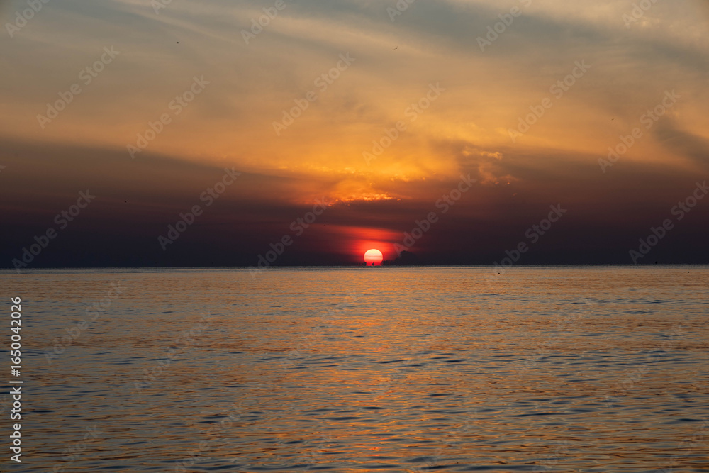 Beautiful sunset on the sea beach with coconut tree for travel in holiday Beautiful sunset on the sea beach with coconut tree for travel in holiday