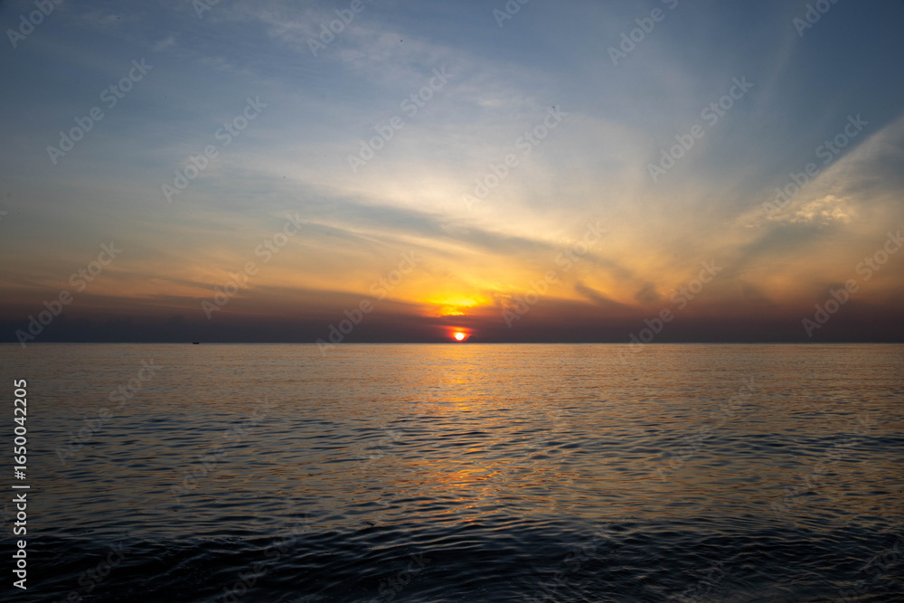 Beautiful sunset on the sea beach with coconut tree for travel in holiday Beautiful sunset on the sea beach with coconut tree for travel in holiday