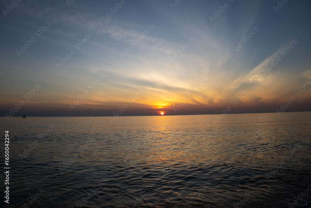 Fototapeta premium Beautiful sunset on the sea beach with coconut tree for travel in holiday
