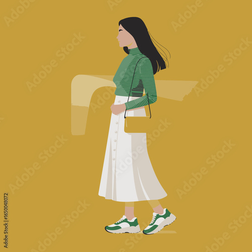 A stylish woman strides gracefully in a contemporary outfit of a striped top and white skirt, accompanied by a casual bag, set against an eye-catching yellow backdrop.
