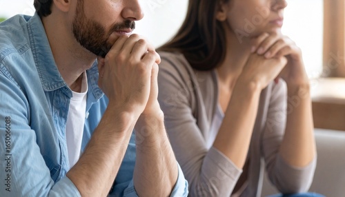Crop close up of unhappy young couple sit separate have problems in relationship think of breakup or divorce. Upset man and woman family lovers avoid talking suffer from cheating in relation troubles.