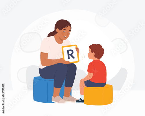 Speech therapist with child learning alphabet and letters