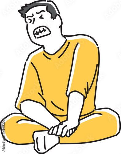 胡坐を組んで悔しがる男性