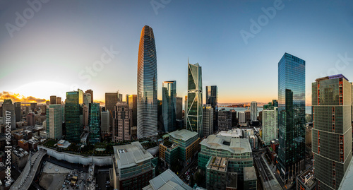 Vibrant Downtown Cityscape at Dusk with Skyscrapers and Cloud Reflection