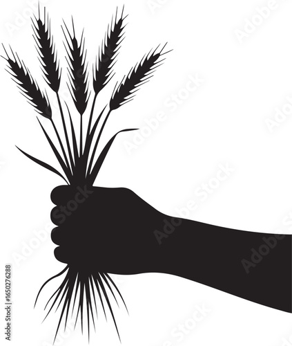 Hand holding wheat stalks symbolizing harvest and abundance