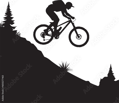 Dynamic cyclist airborne downhill on mountain trail