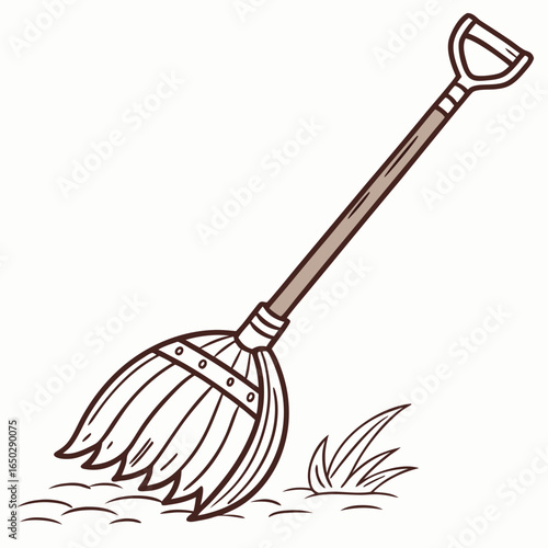 A traditional straw broom leaning against a patch of grass isolated on white background