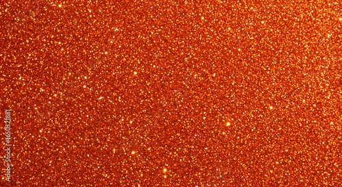 A rich and granular texture of countless small, shiny orange sparkles, ideal for a festive design element.

