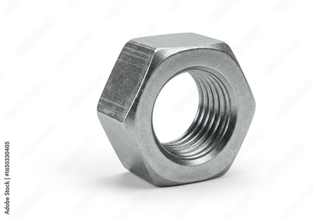 A close up studio shot of a single metal hex nut with threads on a white background surface A close up studio shot of a single metal hex nut with threads on a white background surface