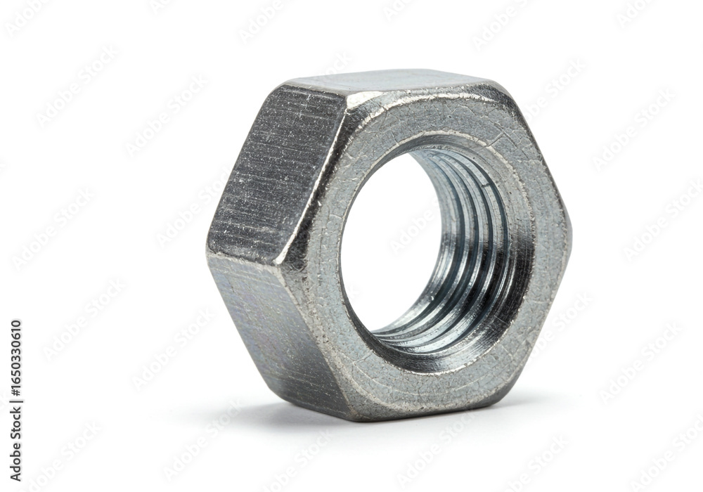 A close up shot of a single silver hex nut with visible threading on a white background A close up shot of a single silver hex nut with visible threading on a white background