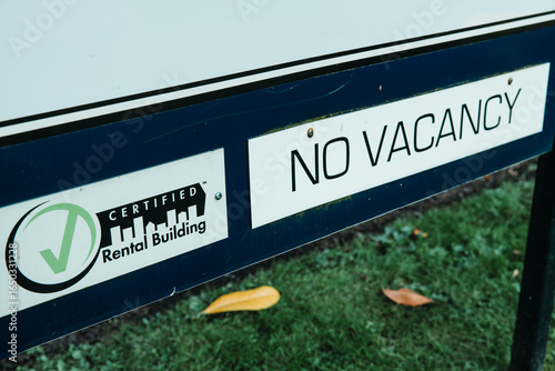 No Vacancy sign on a certified rental building, highlighting high rental prices, less affordability, and fewer apartments available amid tight market conditions
