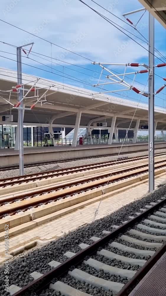 Fast moving Indonesian High Speed Train Whoosh captured as it rushes past the station, highlighting advanced rail technology, dynamic speed, and efficient modern transportation Fast moving Indonesian High Speed Train Whoosh captured as it rushes past the station, highlighting advanced rail technology, dynamic speed, and efficient modern transportation
