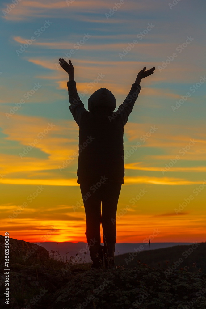 Fototapeta premium beautiful mature women in the mountains at sunset on a summer day