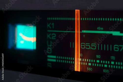 The scale and the tuning indicator and the signal level indicator are fragments of an old analog radio receiver