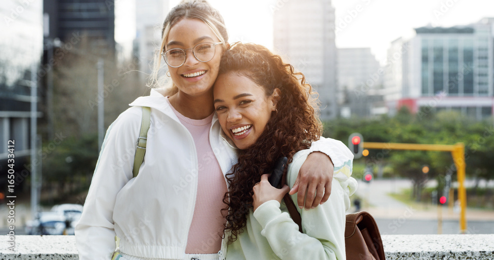 Naklejka premium Students, friends and happy women hug in city for education, university scholarship and laugh. Portrait, college campus and girls embrace outdoor together with gen z for support, funny and bonding