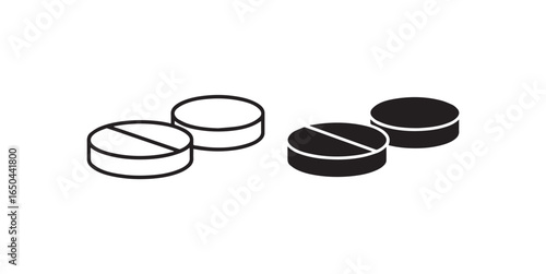 Two white and two black pills with dividing lines medicine health