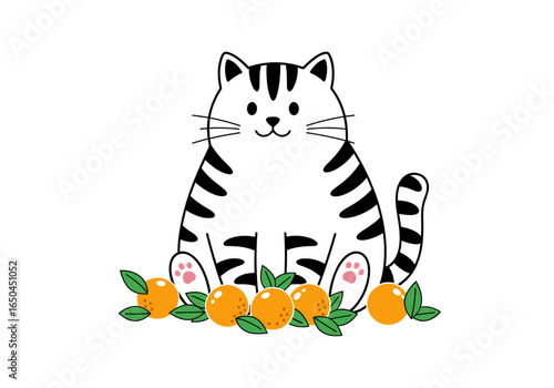 Cute striped cat sitting with oranges and green leaves