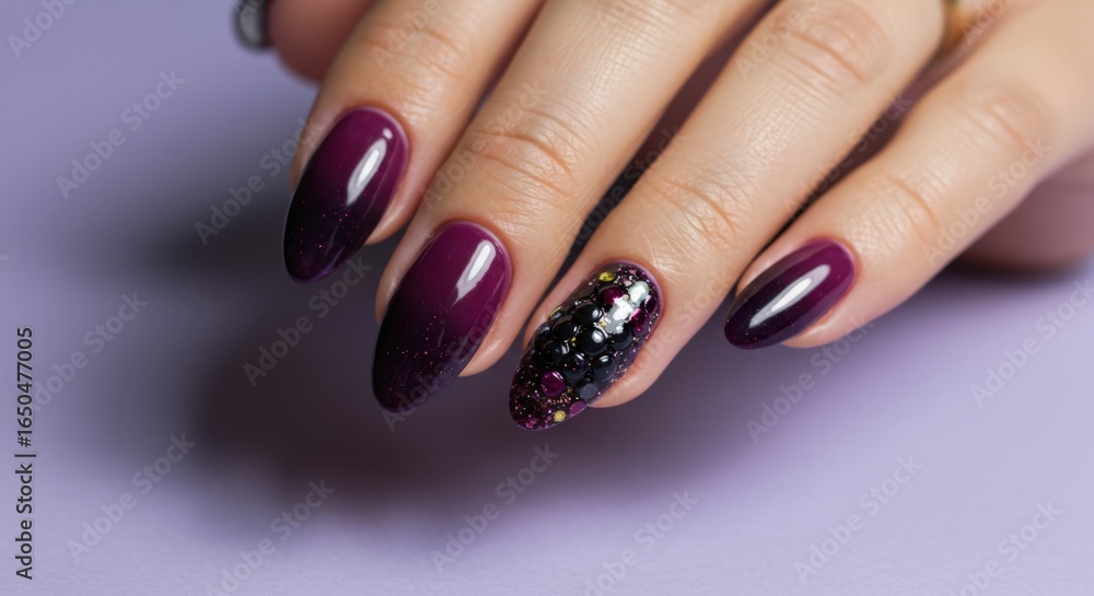 Elegant Woman Hand Showing Dark Purple Gradient Nail Polish with Glitter and Embellishments Elegant Woman Hand Showing Dark Purple Gradient Nail Polish with Glitter and Embellishments