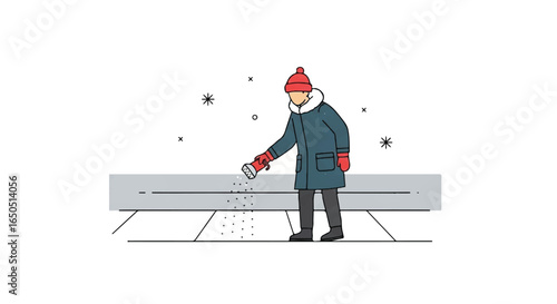 Person in a blue winter coat and red beanie spreading deicing salt on a snowy sidewalk.