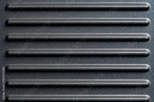 Photography Black grill non-stick die-cast aluminum plates for design purpose, closeup, top view