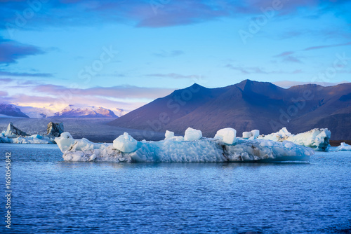 Jokulsarlon glacier lagoon in sunset skyline and sun light background, travel in Iceland destination.