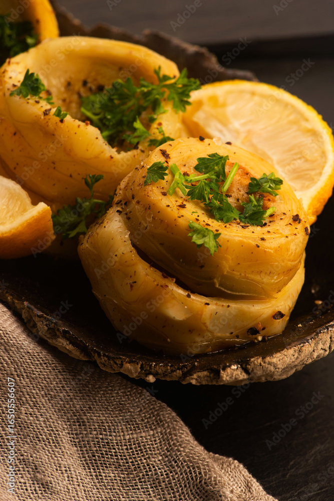Delicious artichoke hearts beautifully seasoned and served in a rustic bowl for a healthy meal Delicious artichoke hearts beautifully seasoned and served in a rustic bowl for a healthy meal