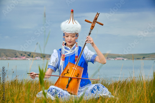 Wallpaper Mural Mongolian female musicians in traditional Mongolian attire playing the morin khuur on the grasslands Torontodigital.ca