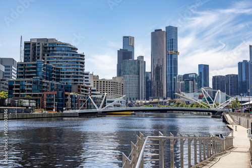 Photos A view of the Yarra River and city architecture of Melbourne, Australia, with the Seafarers Bridge in the distance
