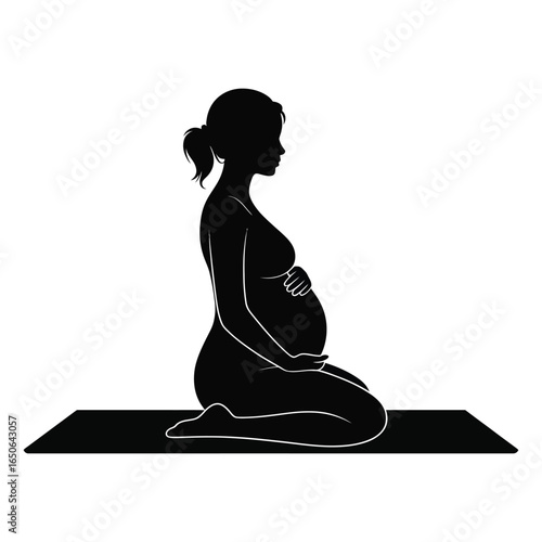 Silhouette of pregnant person kneeling on mat, one hand on belly, peaceful moment of prenatal care, reflection, and emotional connection