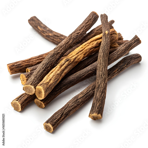 Dried licorice root pieces isolated on white background, used in herbal medicine, natural sweeteners,