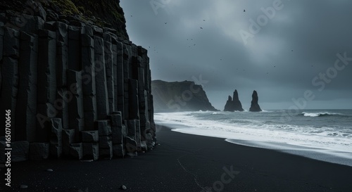 Volcanic sand at Reynisfjara Beach, Vik, Iceland with basalt columns
